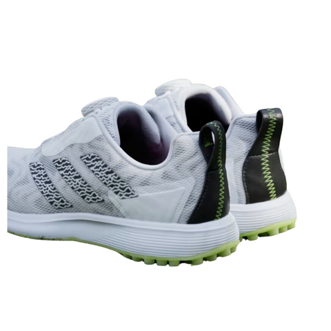 Adidas 2025 Codechaos BOA Junior Golf Shoes in white with black accents, green heel tab stitching, and light green soles, featuring the BOA Fit System, are shown from the back and slightly to the left.