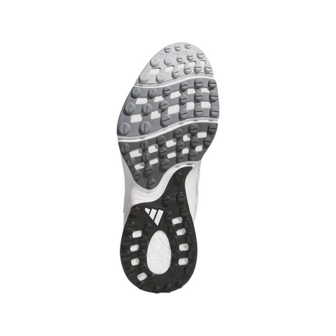 The image displays the sole of the Adidas 2025 Zoysia Boa Spikeless Women’s Golf Shoe in Cloud White, featuring a black, white, and gray textured tread for traction. The Adidas logo appears at the heel center against a plain white background.
