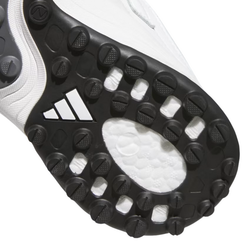 Close-up of the black studded sole on Adidas 2025 Zoysia Boa Spikeless Women’s Golf Shoes in Cloud White, showing the Adidas logo and hexagonal and circular grip patterns designed for enhanced golf course traction.