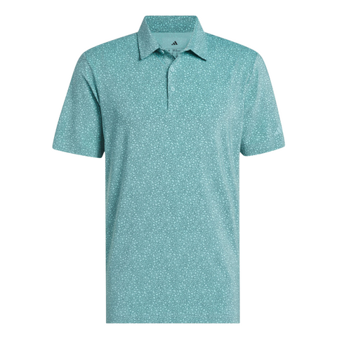 The Adidas Mens Ultimate365 Bunker Polo Shirt in Pure Teal features a subtle white speckled pattern, button-up collar, chest logo, and moisture-wicking fabric to keep you cool on the course. Displayed on a white background.