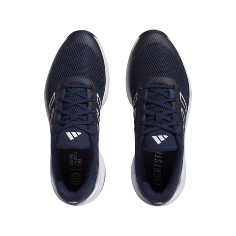 Top view of Adidas Mens ZG23 Vent Golf Shoes (US 8.5, 9 Only) in navy with white soles and laces, diagonal stripe logos, mesh uppers, and insole text reading LIGHTSTRIKE and PLASTIC WASTE with a globe icon. Stylish comfort for golf.