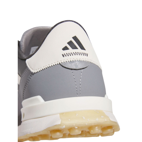 Close-up of the Adidas S2G 24 BOA Men’s Golf Shoes in Carbon/Chalk White/Grey Three, showing a black Adidas logo on the heel, translucent textured sole, and secure BOA Fit System.