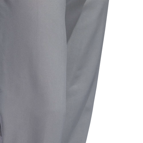 Close-up of light gray Adidas Ultimate365 Mens Golf Pants fabric, showing subtle folds and creases, against a white background.