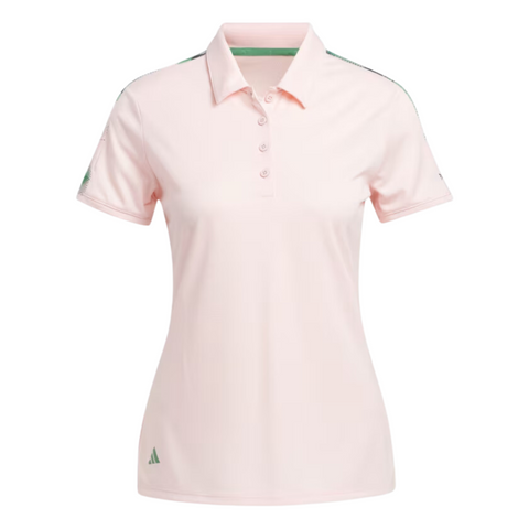 The Adidas Ultimate365 Womens Printed Polo is a light pink, short-sleeve golf shirt with a collar, button placket, green Adidas logo on the lower right, and subtle green detailing on the shoulders and inner collar. Moisture-wicking for comfort.