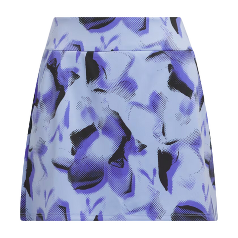 The Adidas Ultimate365 Womens Skort by Adidas is a high-waisted, A-line golf skort with a blue and black abstract floral pattern and a textured dotted effect on a light blue background.