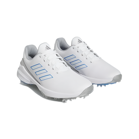 A pair of Adidas Womens ZG23 Golf Shoes in white, blue, and silver (US 7), featuring gray soles and cleats, are displayed side by side on a white background.