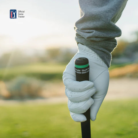 A close-up of a golfer’s gloved hand gripping a club, with a blurred golf course behind. The Arccos logo and Arccos Smart Sensors Gen 4 Green for automatic shot tracking appear in the upper left corner.