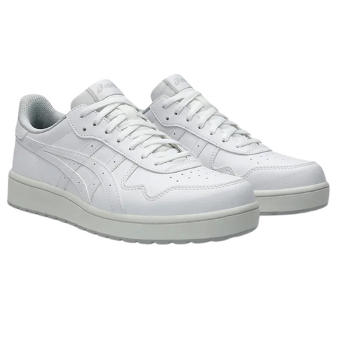 The Asics Japan S Mens Golf Shoes by Asics are white spikeless shoes with white laces, a light gray sole, subtle stitching, and logo details. Displayed on a plain white background, they feature a simple, clean design.
