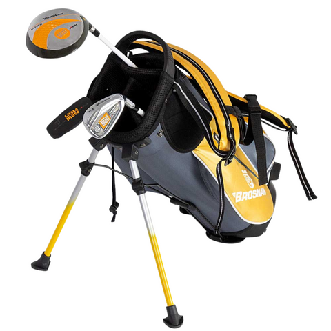 An orange Brosnan Little Mate S7 Junior Golf Package Set (Joey) stands on its extended legs, holding junior-sized clubs with metal heads and black grips—perfect as a first golf clubs set for young players.