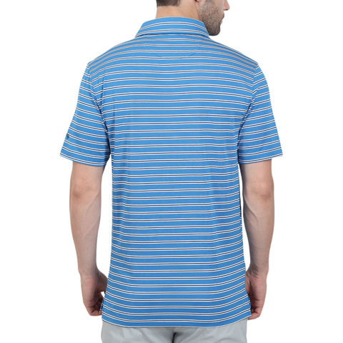 A man, seen from behind, wears a Callaway Adelaide Stripe Mens Polo by Callaway—a blue short-sleeve polo with white and red stripes—and light gray pants.