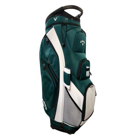 The Callaway Forrester Cart Bag 2025 is a green and white golf bag with a 14-way top, multiple zippered compartments, a top handle, and a front mesh pocket. It stands upright on a white background.
