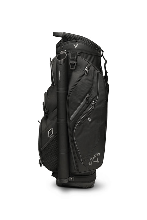 The Callaway Forrester Cart Bag 2025 stands upright in black, featuring a 14-way top, multiple zippered compartments, mesh pockets, and a sturdy handle, all showcasing the iconic Callaway logo on the side.