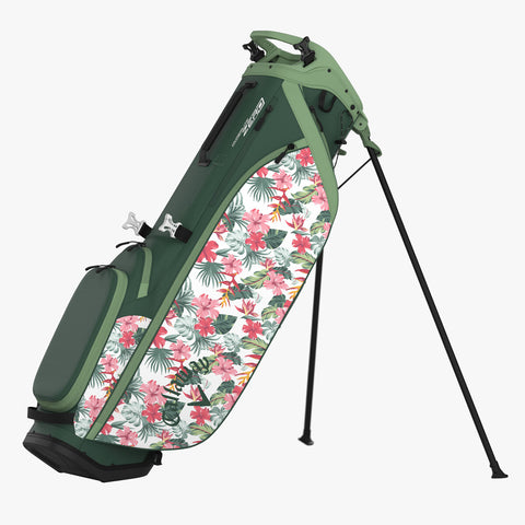 The Callaway Hyperlite Zero 25 Stand Bag by Callaway is an ultra-lightweight green golf stand bag with pink, white, and green tropical floral side panels, multiple pockets, and dual retractable legs.