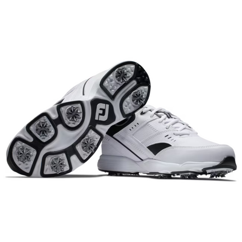 A pair of FootJoy Golf Specialty Mens Shoes in white with black and silver accents, shown with one upright and one displaying the spiked, textured undersole for enhanced grip.