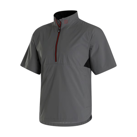 The FootJoy HydroLite X Short Sleeve Rain Shirt is a gray, relaxed-fit pullover with a stand-up collar, half-zip front, and black-red zipper. It features short sleeves and no visible branding or patterns.