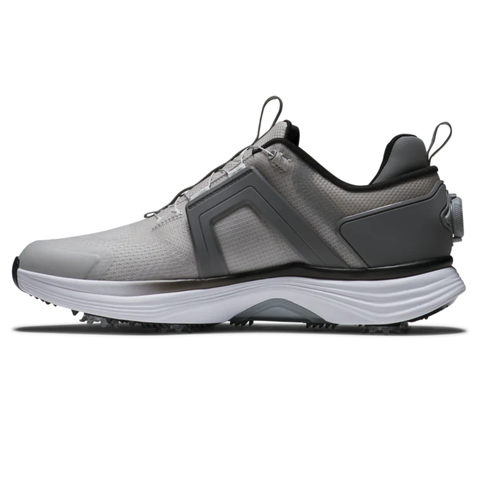 Side view of the FootJoy Men's Hyperflex Boa Golf Shoes in Grey/White, featuring black accents, a textured sole for grip, pull tabs on heel and tongue, and the BOA Fit System for a secure fit.