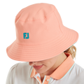 FootJoy Reversible Bucket Hat Teal/Peach – Peach side worn view