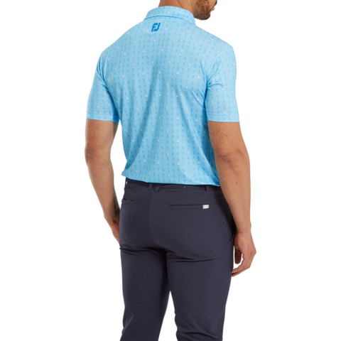 A man faces away, wearing a light blue patterned FootJoy The 19th Hole Lisle Mens Polo and dark blue pants. This moisture-wicking polo features a small FootJoy logo on the upper back below the collar.