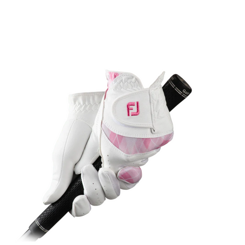 Gloved hands wear FootJoy Women’s Attitudes Glove in white and pink while holding a black golf club against a plain white background.