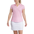 A woman wears the FootJoy Women’s Cap Sleeve Print Shirt in Pink Lemonade, paired with a white skirt. She stands against a white background, looking to the side and smiling.