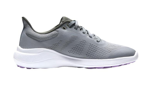 The FootJoy Women's Flex Golf Shoes in grey feature a white sole, light purple bottom accents, all-day comfort, and course-ready grip, shown in a side profile view on a white background.