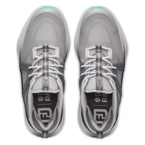 Top view of FootJoy Women's Hyperflex Golf Shoes in grey and teal, featuring white laces, light gray mesh uppers, dark gray accents, turquoise toe details, and insoles with text and a white geometric logo.