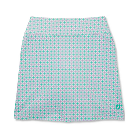 The FootJoy Womens Performance Knit Skort features a geometric light purple, teal, and white plus sign pattern, a small teal logo by the hem, wide waistband, straight fit, and moisture-wicking comfort for golf.