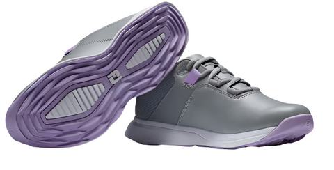 A pair of FootJoy Women's ProLite Golf Shoes in grey, featuring purple soles and accents. One lightweight shoe stands upright, while the other lies on its side, highlighting the sole’s grippy textured pattern.