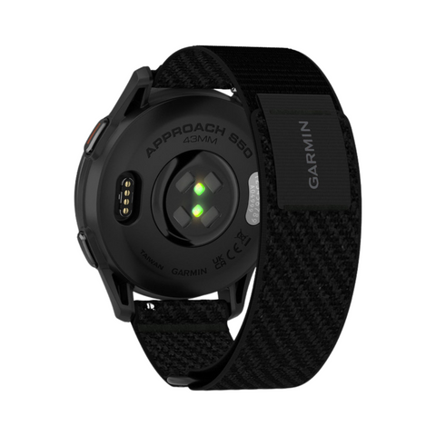 Back view of a Garmin Approach S50 GPS Watch with a black woven strap, displaying the charging port, green heart rate sensor light, and GARMIN label on the strap.