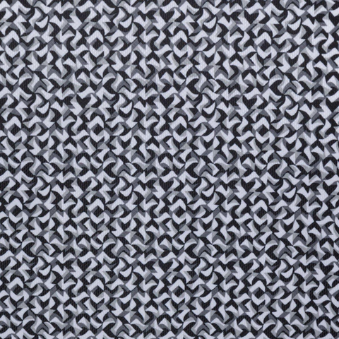 A close-up of the Greg Norman Men’s Great White Mosaic Ultra Stretch Polo in black and white shows interlocking geometric shapes forming a uniform, optical illusion pattern throughout the shirt.