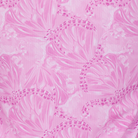 Close-up of Greg Norman Women’s Play Dry Butterfly Polo in Pastel Lavender, featuring a delicate, whimsical butterfly wing print in varying shades of pink.