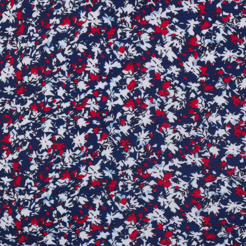 The Greg Norman Women’s Play Dry Prestige Camo Floral Polo in Navy/Red features a small white and red floral camo print on dark blue, offering style and breathability—perfect for your next round of golf.