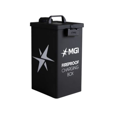 The MGI Fire Proof Charging Box by MGI is a black, rectangular charging box with a lid handle and white star logo, designed for safe lithium battery storage for electric golf buggies. Shown on a plain white background.