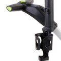 A close-up of the MGI ZIP umbrella holder by MGI, featuring circular cutouts and a green button, mounted on a golf push cart handle for ergonomic and comfortable use.