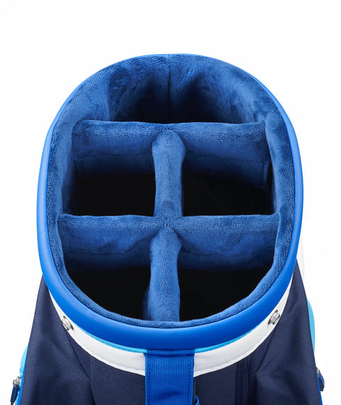 The Mizuno 2025 Tour Cart Bag features six plush-lined dividers for club organization, a navy and white exterior, and a sturdy blue handle—all designed to meet tour-level standards.