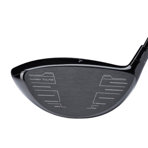 Close-up of the Mizuno ST-MAX 230 Driver clubhead, with shaft and etched grooves visible. The clubface shows “FORGED TI-LFS,” highlighting Mizuno’s advanced CORTECH Chamber technology.