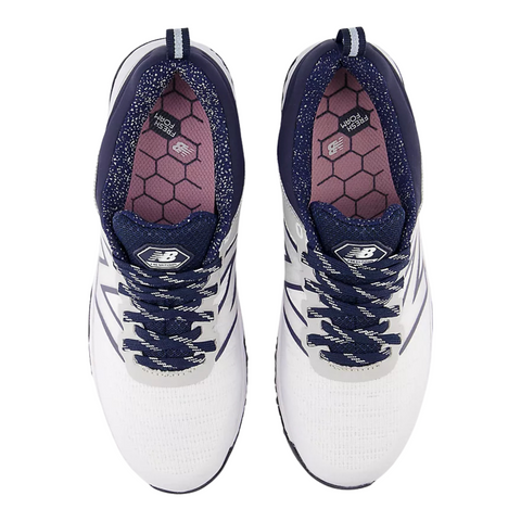 Top view of New Balance Fresh Foam Contend V2 Womens Golf Shoes in white/navy, featuring navy laces, navy accents, hexagonal pink insoles with visible logos, and lightweight cushioning for comfort on or off the course.