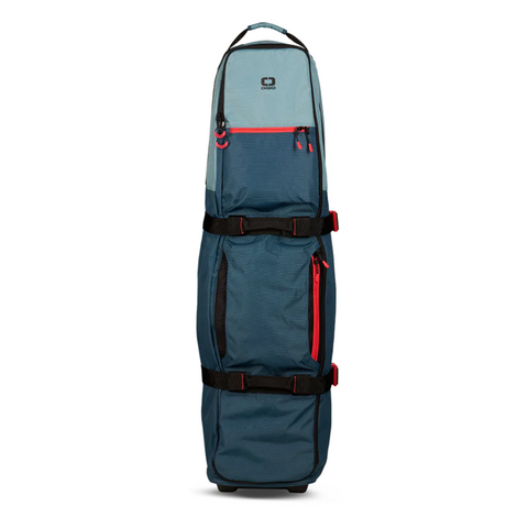 The Ogio Alpha Mid Travel Cover by Ogio is tall, blue and grey, with black straps, red zippers, a top handle, and bottom wheels—ideal for transporting large items or sports gear with enhanced club protection.