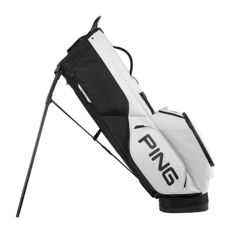 The PING Hoofer Tour Stand Bag by Ping is shown upright with its legs extended, featuring a large PING logo on the side and offering ample tour-level storage for golfers.