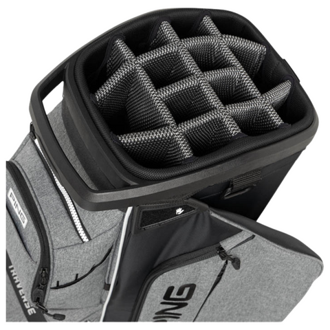 A close-up of the Ping Traverse 244 Cart Bag, a lightweight gray golf bag with a 14-way divider top and multiple side zippered pockets.