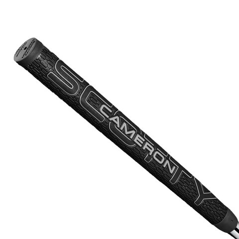 A limited edition Scotty Cameron 2025 Phantom Black 11 Putter grip in black features bold white CAMERON lettering with partial SC and TY on a textured surface—ideal for fans of this exclusive putter.