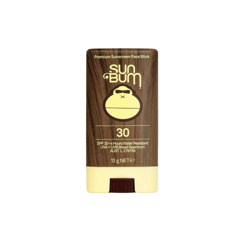 The Sun Bum SPF 30 Face Stick | 13g is a mess-free, upright sunscreen in a brown and yellow container with the Sun Bum monkey logo—ideal as your go-to golf sunscreen.