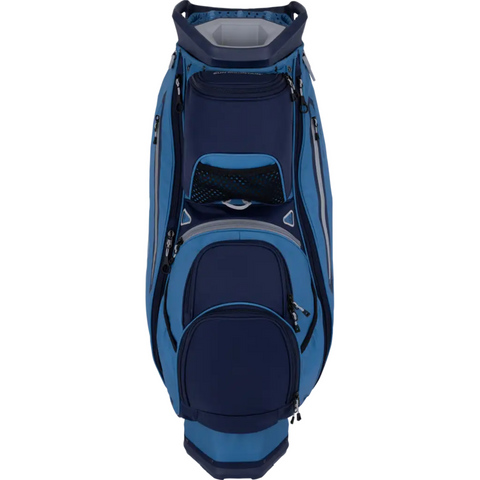 The Sun Mountain C-130 Sync Cart Bag 2024 in blue and navy features multiple zippered pockets and compartments, shown upright—an ideal Sun Mountain push cart golf bag for organized on-course storage.
