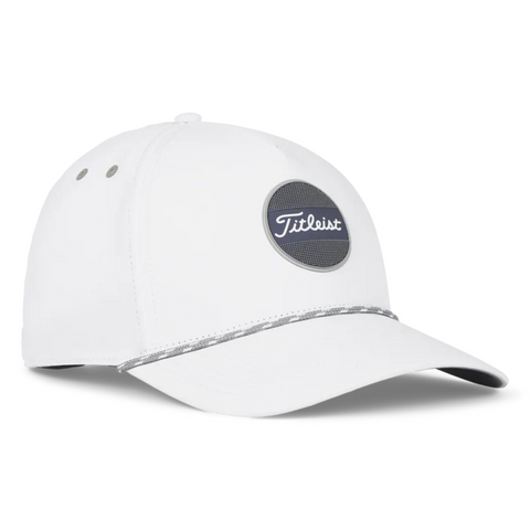 The Titleist 2025 Boardwalk Rope Cap is a white cap with a curved brim, featuring a black and white Titleist logo patch on the front and a thin silver rope accent above the brim.
