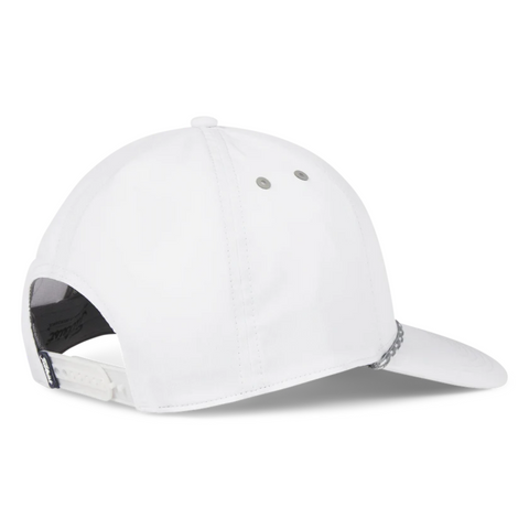 A Titleist 2025 Boardwalk Rope Cap in white is shown from the back left, highlighting two ventilation eyelets, a curved brim, rope accent detail, and an adjustable snapback closure.