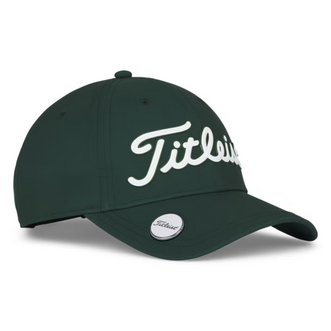 The Titleist 2025 Players Performance Ball Marker Cap is dark green with Titleist in large white script on the front, a magnetic ball marker, and a Titleist logo sticker on its curved green brim.