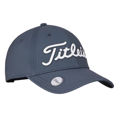 The Titleist 2025 Players Performance Ball Marker Cap is a dark blue cap featuring Titleist in white cursive on the front and a round silver magnetic ball marker on the brim, offering golfers both style and function.