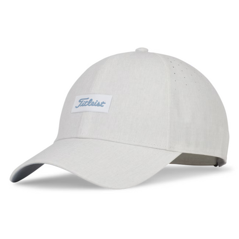 The Titleist 2025 Womens Charleston Breezer Cap in Heather White features a curved brim, front logo patch, UV protection, side ventilation holes, and an adjustable back strap. Ideal for golf, this light grey cap is stylish and functional.