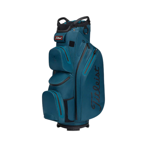 A blue Titleist Cart 14 StaDry Golf Bag by Titleist, featuring multiple zippered pockets and black Titleist branding on the side, stands upright on a white background.