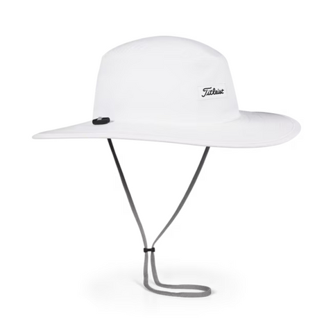 The Titleist Charleston Aussie Bucket Hat in White/Black features a black Titleist logo, an adjustable gray chin strap, and a wide brim for sun protection.